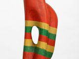 sculpture of a red, green, and yellow sculpture on a white pedestal
