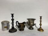 four different types of candlesticks and a candelab