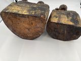 pair of antique cast iron tea kettles with wooden handles