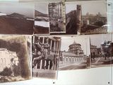 many old photos hanging on the wall of a building