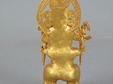 a gold figurine of an elephant with a crown on its head