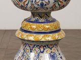 a vase that is sitting on top of a wooden table