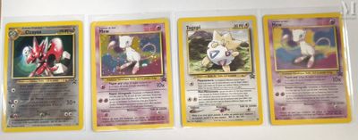 four pokemon cards are on a white surface with a yellow border