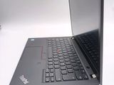 a laptop computer sitting on a table with a keyboard