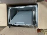 a box with a laptop inside of it sitting on the floor