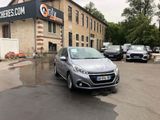 a silver car parked in front of a building in a parking lot