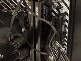 a close up of a computer motherboard with wires and wires attached to it