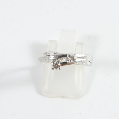 sterling silver ring with brown diamonds on a white background