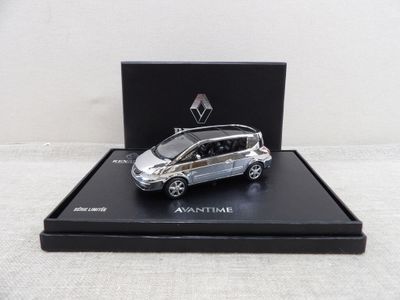 the small silver car is in a black box on a white surface