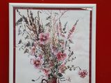 a picture of a painting of a vase of flowers on a table