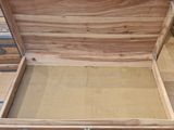 a wooden box that is open on the floor