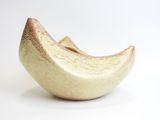 a white and gold bowl with a banana on it
