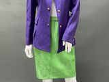 an image of a mannequin wearing a purple jacket and green skirt
