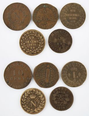 a group of five different coins with the names of different countries