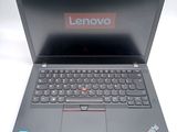 a laptop that has a lenovo logo on the screen