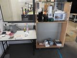 a desk with a mirror and a microwave on top of it