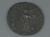 an old coin with a cross on it on a table