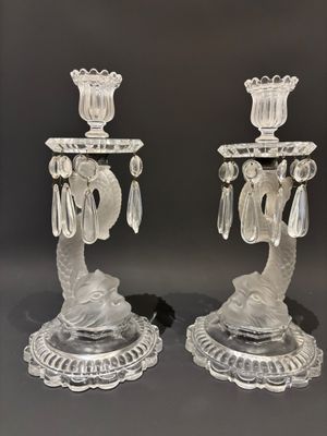 pair of clear glass candlesticks with crystal drops on each of them