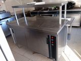 a stainless steel counter top in a commercial kitchen
