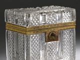 a clear glass box with a gold trim around it