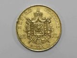 l'image d'une pièce d'or sur laquelle figurent des armoiries