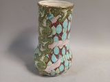 a vase that has a bird design on it