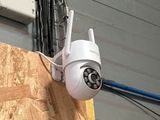 a camera attached to the side of a building