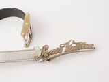 a belt and a belt buckle on a white surface