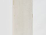 a white surfboard sitting in the snow on the ground