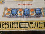 a table cloth with a picture of egyptian scarabs on it
