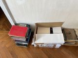 many books stacked on top of each other on the floor