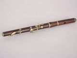 a close up of a flute on a white surface with a white background