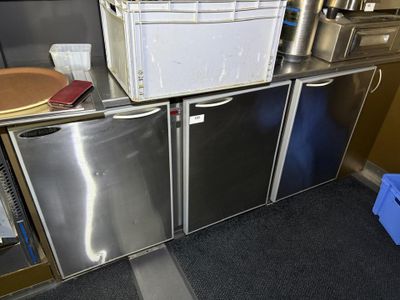 a small kitchen with a lot of stainless steel appliances