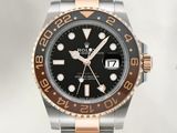 Montre Rolex avec bracelet bicolore en acier et cadran noir
