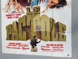 a poster of a movie with a man holding a gun