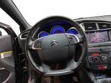 the interior of a car with a steering wheel and dashboard controls
