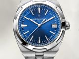 a close up of a watch with a blue dial