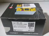 a black box with a yellow sticker on top of it