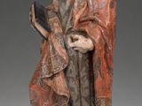 a statue of a man with a book in his hand