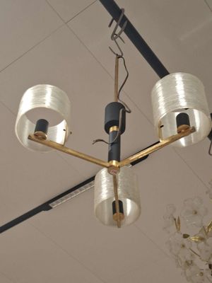 a chandelier hanging from the ceiling in a room