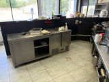 a kitchen with a lot of counter space in it
