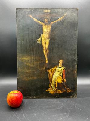 une image représentant un tableau de Jésus sur la croix avec une pomme