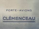a sign that says port - avions clementeau on the side of a building