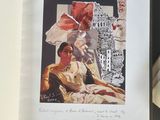 a picture of a woman sitting in a chair next to an open book