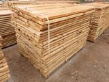 many stacks of lumber stacked on top of each other