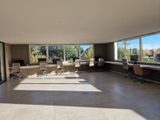 a large room with a lot of windows and a lot of desks
