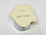 a small white box with a note on it
