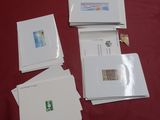 many cards and envelopes laid out on a table