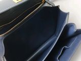 the inside of a blue purse with a zipper open