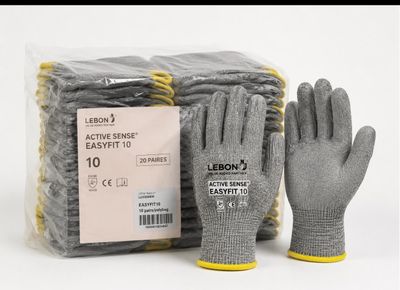 two pairs of gloves and a bag of gloves on the table